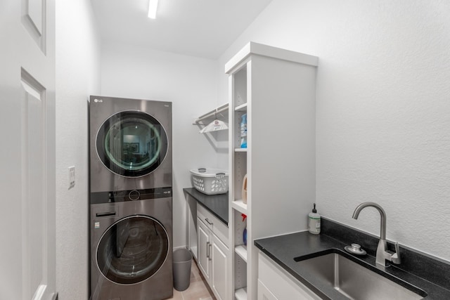 2704 Aurora, Horseshoe Bay, TX 78657 - laundry area with stacked washer / drying machine and cabinet space