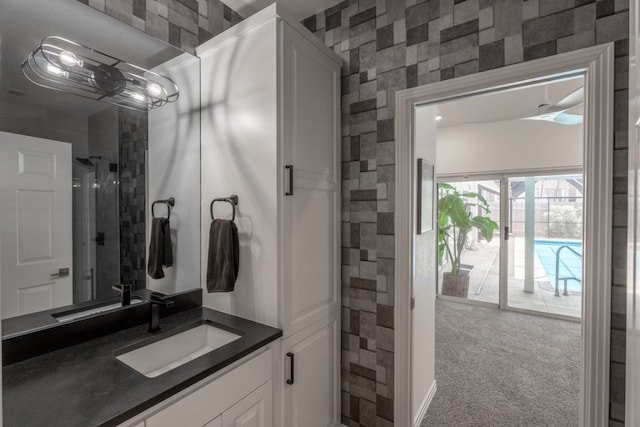 2704 Aurora, Horseshoe Bay, TX 78657 - bathroom featuring vanity and wallpapered walls