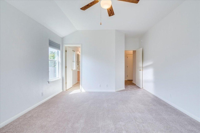 117 Spillway Dr, Kyle, TX 78640 - unfurnished bedroom with light carpet, lofted ceiling, baseboards, ensuite bath, and a ceiling fan