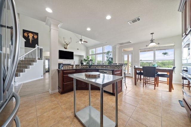 1581 Grassy Field Rd, Austin, TX 78737 - kitchen featuring ornate columns, dark countertops, appliances with stainless steel finishes, a ceiling fan, and recessed lighting
