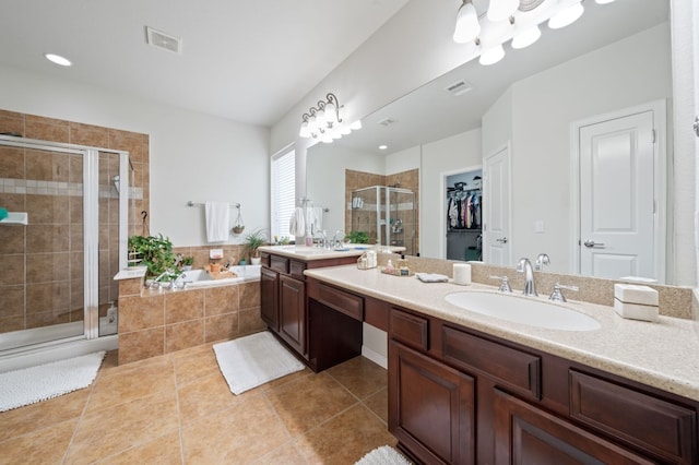 1581 Grassy Field Rd, Austin, TX 78737 - full bath with vanity, a shower stall, a garden tub, tile patterned flooring, and a walk in closet