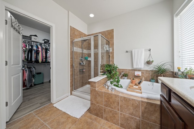 1581 Grassy Field Rd, Austin, TX 78737 - full bath with a bath, a shower stall, tile patterned floors, and a spacious closet