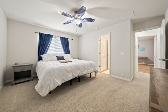 1581 Grassy Field Rd, Austin, TX 78737 - bedroom featuring light carpet, baseboards, and ceiling fan