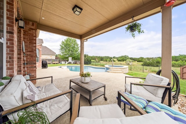 1581 Grassy Field Rd, Austin, TX 78737 - fenced backyard with an outdoor living space, a pool with connected hot tub, a patio area, and area for grilling