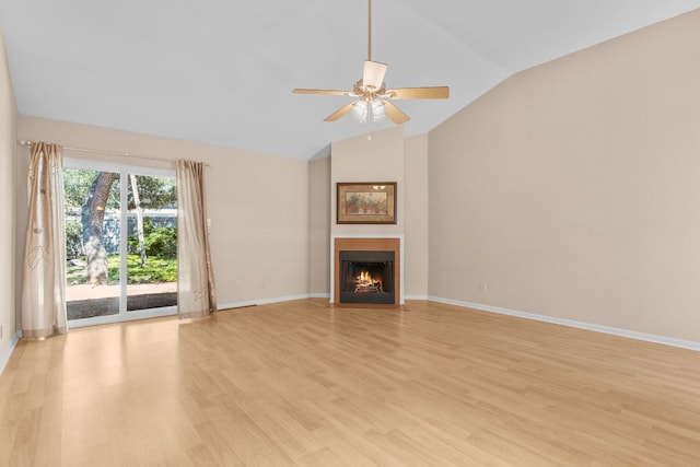 9226 Jollyville Rd Unit 191, Austin, TX 78759 - unfurnished living room with vaulted ceiling, light wood-type flooring, a ceiling fan, and baseboards