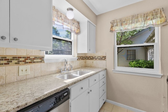 9226 Jollyville Rd Unit 191, Austin, TX 78759 - kitchen with a sink, dishwasher, white cabinetry, and light countertops