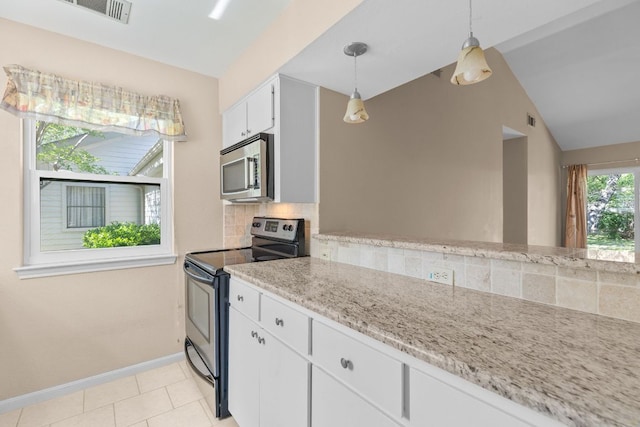 9226 Jollyville Rd Unit 191, Austin, TX 78759 - kitchen with appliances with stainless steel finishes, tasteful backsplash, baseboards, vaulted ceiling, and pendant lighting