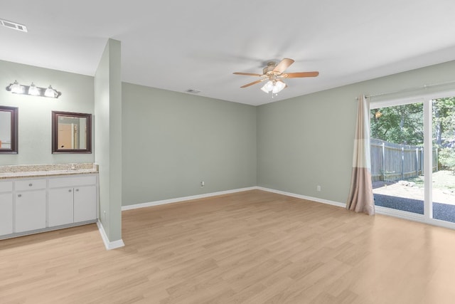 9226 Jollyville Rd Unit 191, Austin, TX 78759 - unfurnished living room with a ceiling fan, light wood-style flooring, and baseboards