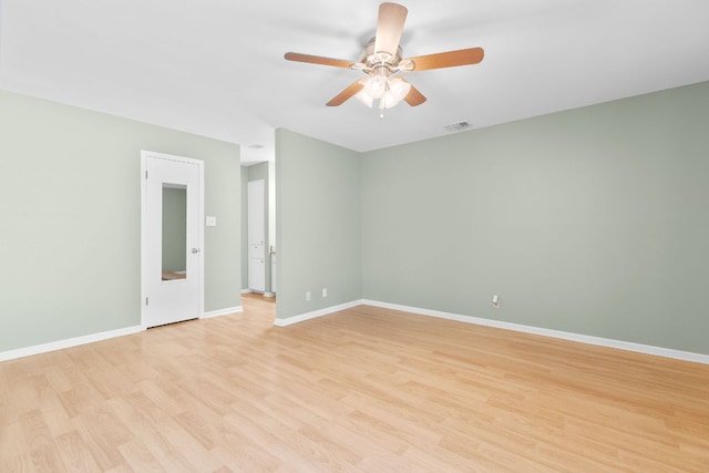 9226 Jollyville Rd Unit 191, Austin, TX 78759 - empty room featuring light wood-style floors, a ceiling fan, and baseboards