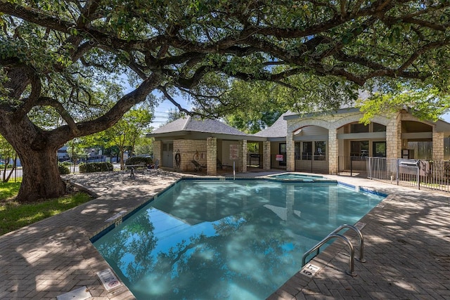 9226 Jollyville Rd Unit 191, Austin, TX 78759 - view of swimming pool featuring a patio area and a pool with connected hot tub