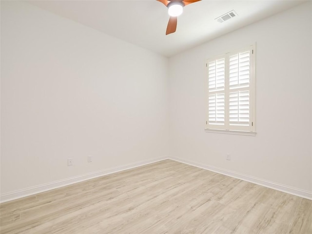 15701 Sayan Cv, Bee Cave, TX 78738 - spare room with light wood-style floors, a ceiling fan, and baseboards