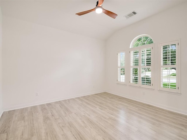 15701 Sayan Cv, Bee Cave, TX 78738 - spare room with light wood-style flooring, a ceiling fan, lofted ceiling, and baseboards