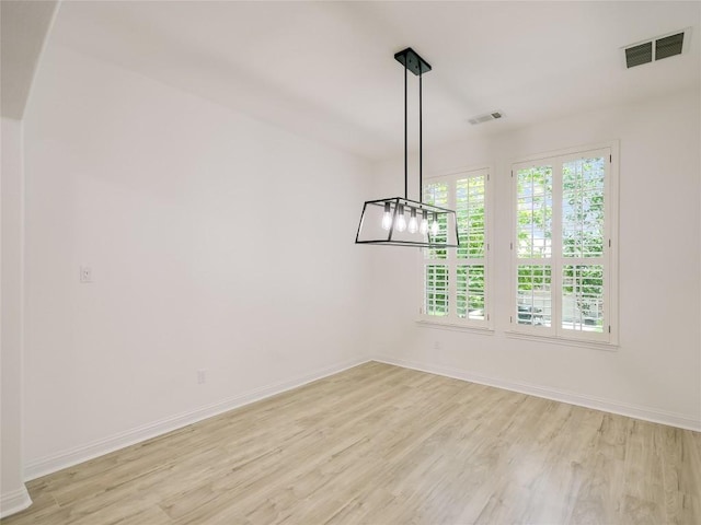 15701 Sayan Cv, Bee Cave, TX 78738 - unfurnished dining area featuring light wood-style flooring