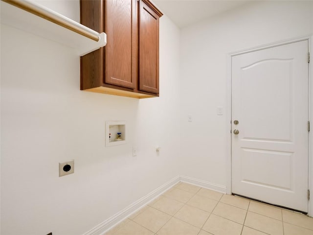 15701 Sayan Cv, Bee Cave, TX 78738 - laundry room with electric dryer hookup, hookup for a washing machine, cabinet space, baseboards, and light tile patterned flooring