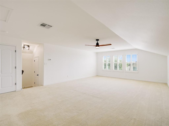 15701 Sayan Cv, Bee Cave, TX 78738 - spare room featuring light carpet, vaulted ceiling, and a ceiling fan