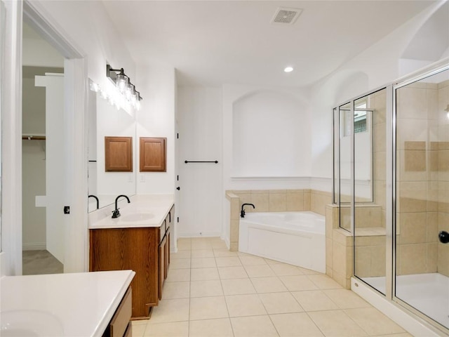 15701 Sayan Cv, Bee Cave, TX 78738 - full bath with vanity, a shower stall, a bath, tile patterned floors, and recessed lighting
