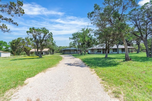 226 Mesa Rdg, Leander, TX 78641 - ranch-style home featuring gravel driveway, a garage, and a front lawn