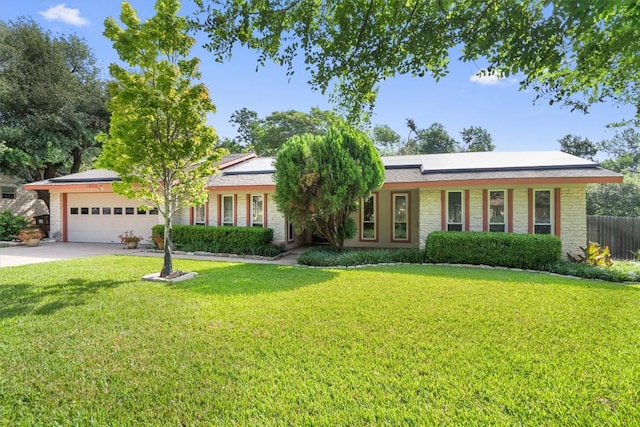 13215 Woodthorpe St, Austin, TX 78729 - single story home with roof mounted solar panels, driveway, and an attached garage