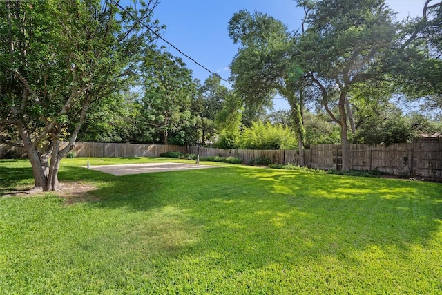 13215 Woodthorpe St, Austin, TX 78729 - view of yard with a patio