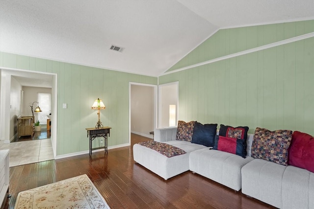 13215 Woodthorpe St, Austin, TX 78729 - living area with hardwood / wood-style floors, vaulted ceiling, and baseboards