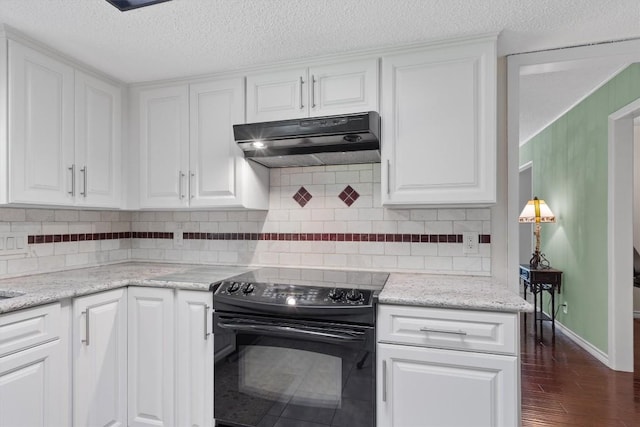 13215 Woodthorpe St, Austin, TX 78729 - kitchen featuring black electric range, under cabinet range hood, white cabinetry, dark wood-style flooring, and backsplash