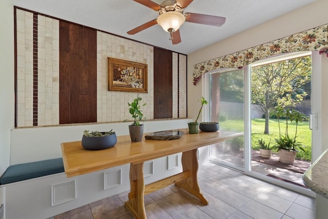 13215 Woodthorpe St, Austin, TX 78729 - tiled dining room with a ceiling fan
