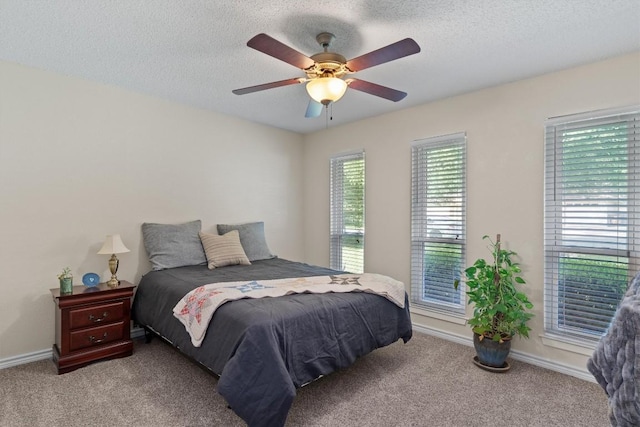13215 Woodthorpe St, Austin, TX 78729 - bedroom featuring carpet, a textured ceiling, a ceiling fan, and baseboards