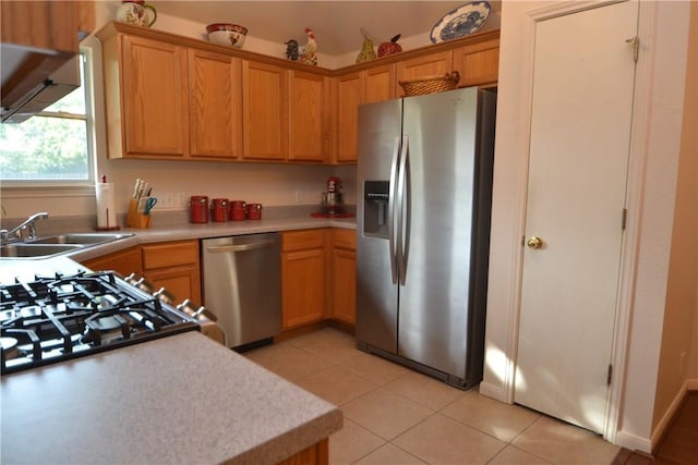 241 Wild Buffalo Dr, Kyle, TX 78640 - kitchen with appliances with stainless steel finishes, light countertops, and light tile patterned floors