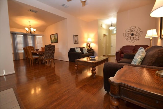 241 Wild Buffalo Dr, Kyle, TX 78640 - living area featuring wood finished floors, a chandelier, vaulted ceiling, and ceiling fan