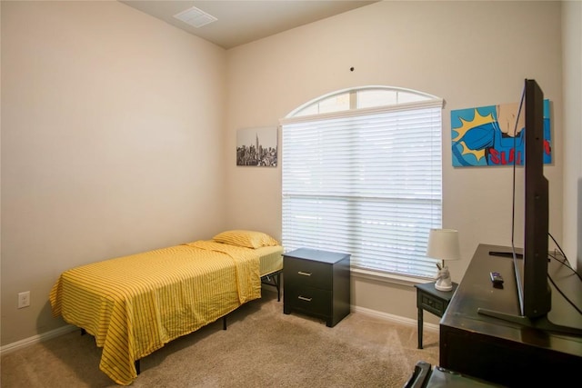 19108 Obed River Dr, Pflugerville, TX 78660 - carpeted bedroom with multiple windows, an office area, and baseboards