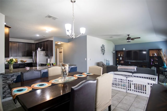 19108 Obed River Dr, Pflugerville, TX 78660 - dining space with a ceiling fan, light tile patterned floors, and a chandelier