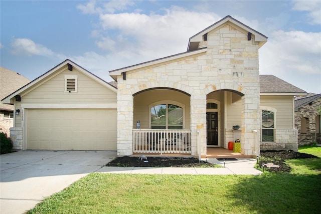 19108 Obed River Dr, Pflugerville, TX 78660 - french country style house featuring a porch, stone siding, concrete driveway, and an attached garage
