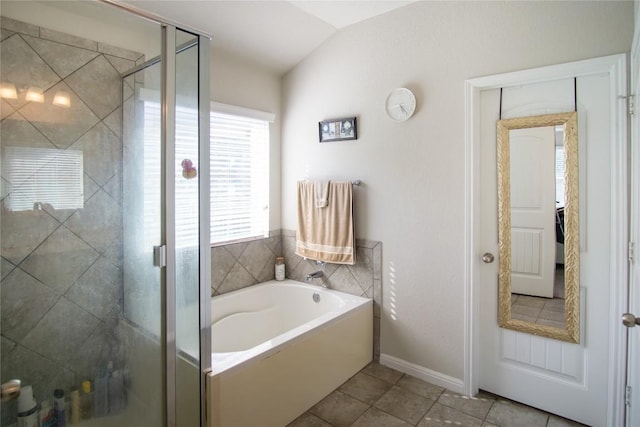 19108 Obed River Dr, Pflugerville, TX 78660 - bathroom featuring a garden tub, a shower stall, lofted ceiling, and tile patterned floors