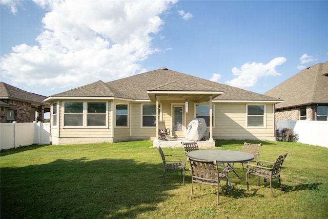 19108 Obed River Dr, Pflugerville, TX 78660 - rear view of house with a fenced backyard and roof with shingles