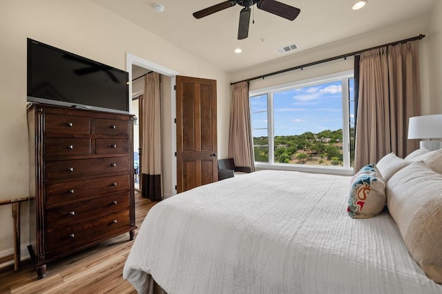 416 Marina Village Cv Unit 416, Austin, TX 78734 - bedroom featuring light wood finished floors, vaulted ceiling, recessed lighting, and a ceiling fan