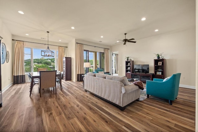 416 Marina Village Cv Unit 416, Austin, TX 78734 - living room featuring recessed lighting, dark wood-style flooring, baseboards, a chandelier, and a ceiling fan
