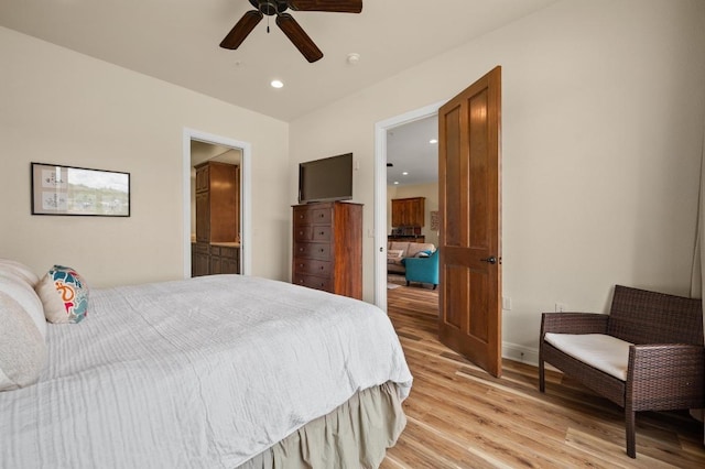 416 Marina Village Cv Unit 416, Austin, TX 78734 - bedroom featuring light wood-style flooring, recessed lighting, baseboards, ceiling fan, and connected bathroom