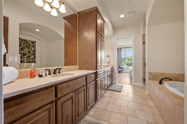 416 Marina Village Cv Unit 416, Austin, TX 78734 - full bathroom with a bath, vanity, a chandelier, tile patterned floors, and a shower