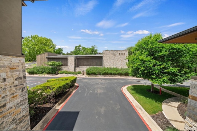 416 Marina Village Cv Unit 416, Austin, TX 78734 - view of asphalt road with curbs