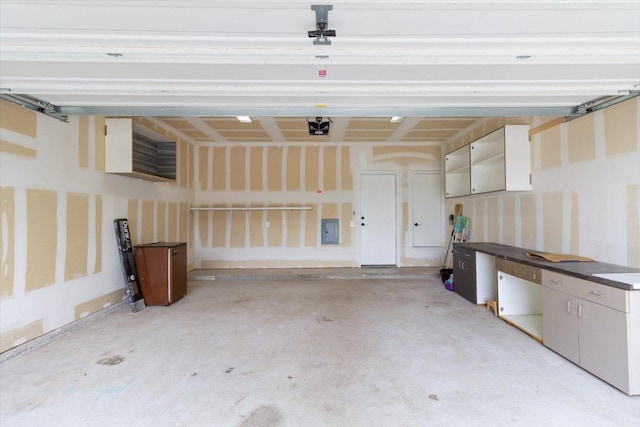 6729 Sunderland Trl, Austin, TX 78747 - garage with electric panel and a garage door opener