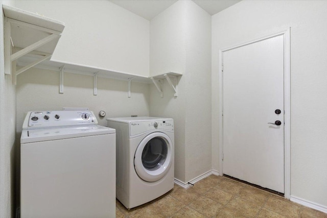 6729 Sunderland Trl, Austin, TX 78747 - laundry room featuring washing machine and dryer and baseboards
