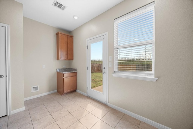 14125 Fallsprings Way, Manor, TX 78653 - entryway featuring baseboards and light tile patterned flooring