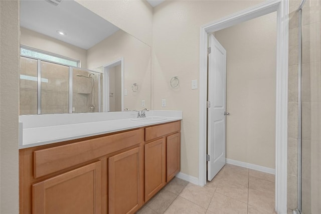 14125 Fallsprings Way, Manor, TX 78653 - full bathroom with a stall shower, vanity, and tile patterned floors