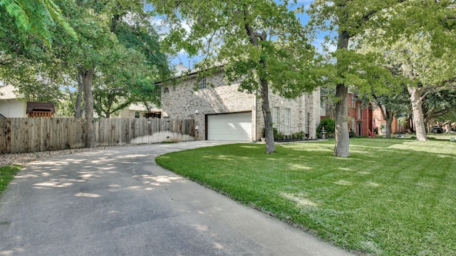 3504 Ashmere Loop SE, Round Rock, TX 78681 - obstructed view of property with driveway, an attached garage, and brick siding