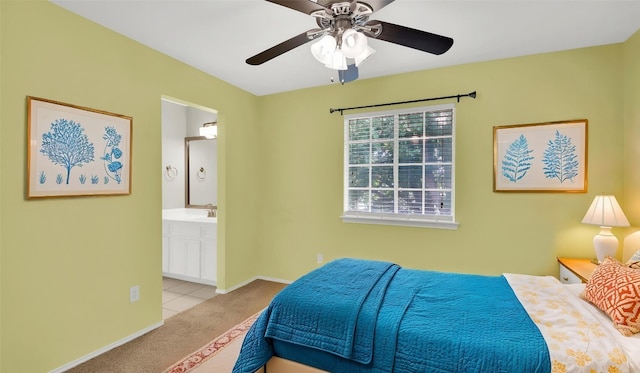 3504 Ashmere Loop SE, Round Rock, TX 78681 - carpeted bedroom featuring connected bathroom and a ceiling fan