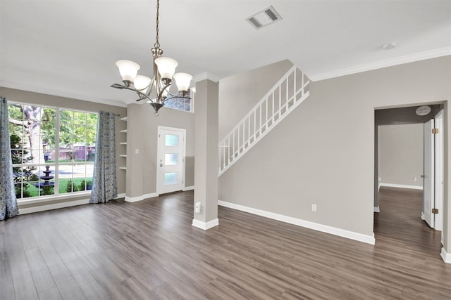 3504 Ashmere Loop SE, Round Rock, TX 78681 - foyer entrance featuring crown molding, dark wood-style flooring, a chandelier, and stairway