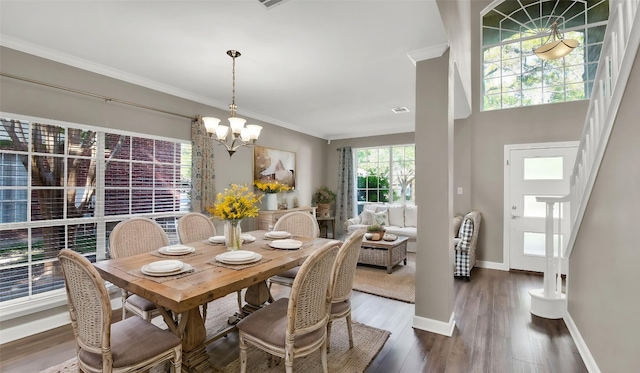 3504 Ashmere Loop SE, Round Rock, TX 78681 - dining room featuring a chandelier, crown molding, and wood finished floors