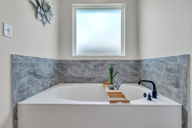 222 Overlook Trl, Copperas Cove, TX 76522 - bathroom with a garden tub and a textured wall