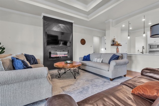 222 Overlook Trl, Copperas Cove, TX 76522 - living area featuring crown molding, a large fireplace, wood finished floors, and recessed lighting