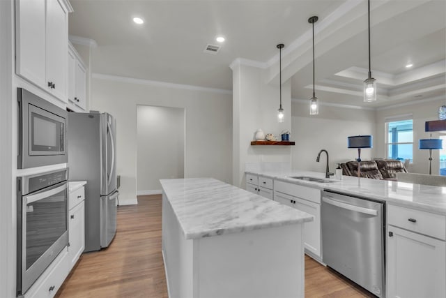 222 Overlook Trl, Copperas Cove, TX 76522 - kitchen with stainless steel appliances, a sink, crown molding, a kitchen island, and white cabinetry